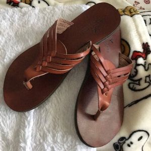 AE brown flip flops